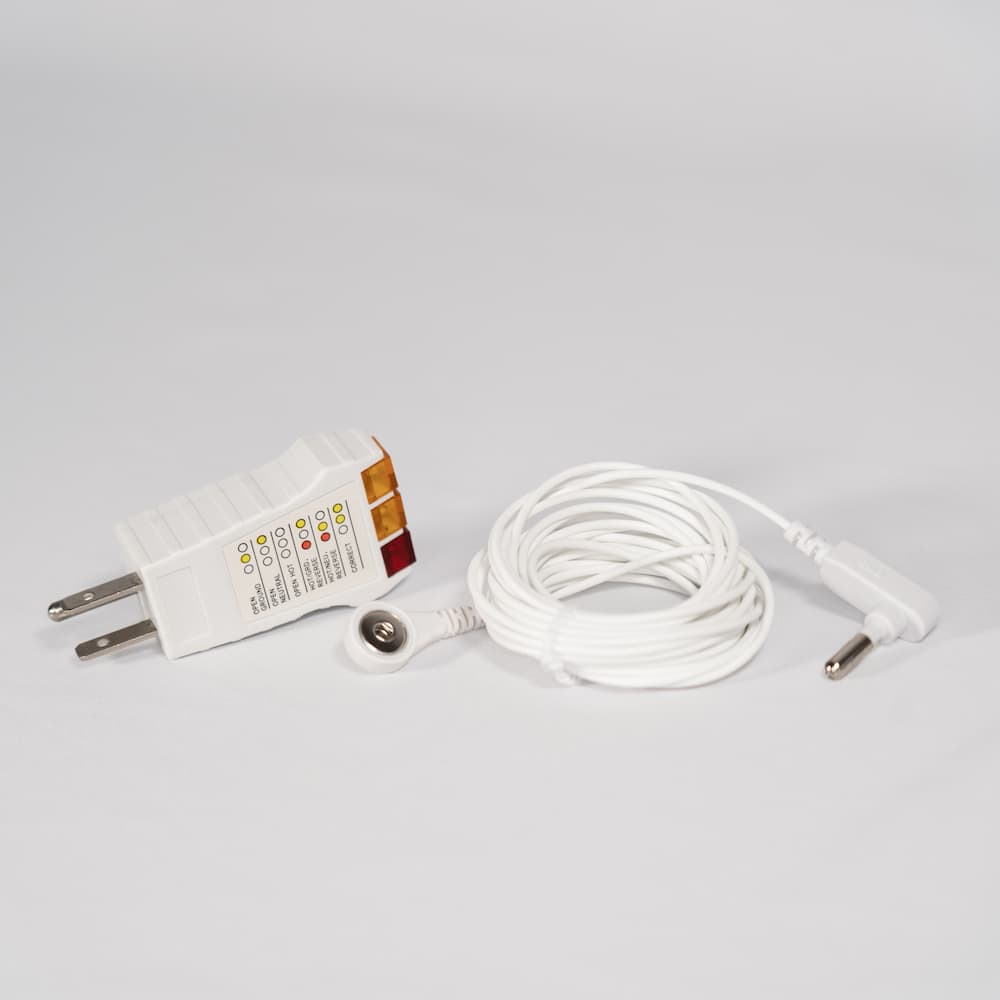 Tala grounding sheet accessories kit including cord, adapter, and outlet tester, displayed on a clean white background for easy setup.