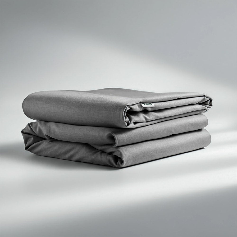 Folded Tala grounding sheet with branded logo tag visible, neatly displayed to highlight premium quality, craftsmanship, and natural earthing benefits.