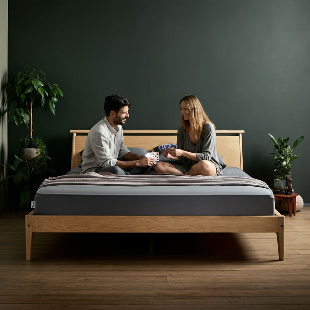 Tala grounding sheet in queen size laid out on a neatly made bed in a bright, modern bedroom. Promotes better sleep, reduced inflammation, and natural earthing.