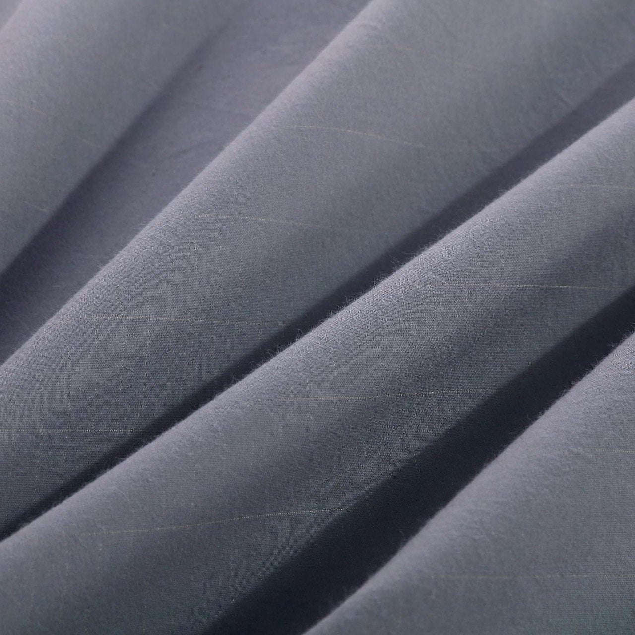 Close-up of the Tala grounding sheet fabric highlighting the fine conductive silver threads woven into the soft, breathable material for effective earthing.