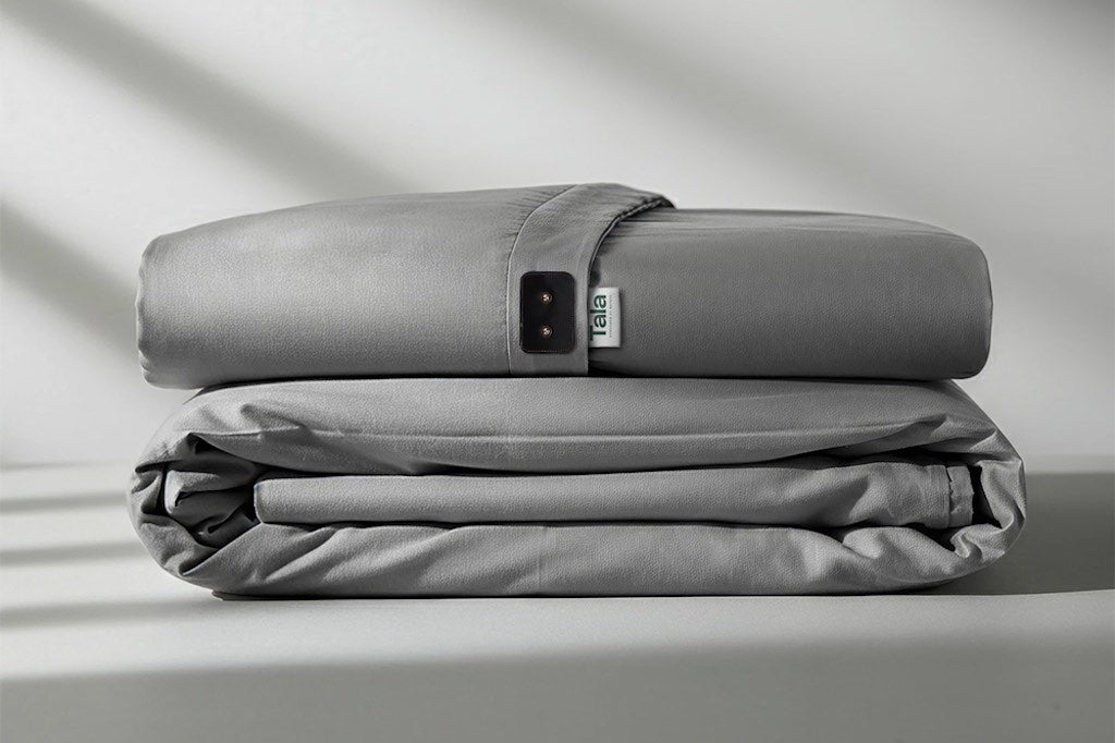 Grey grounding sheet neatly folded over a light grey backdrop